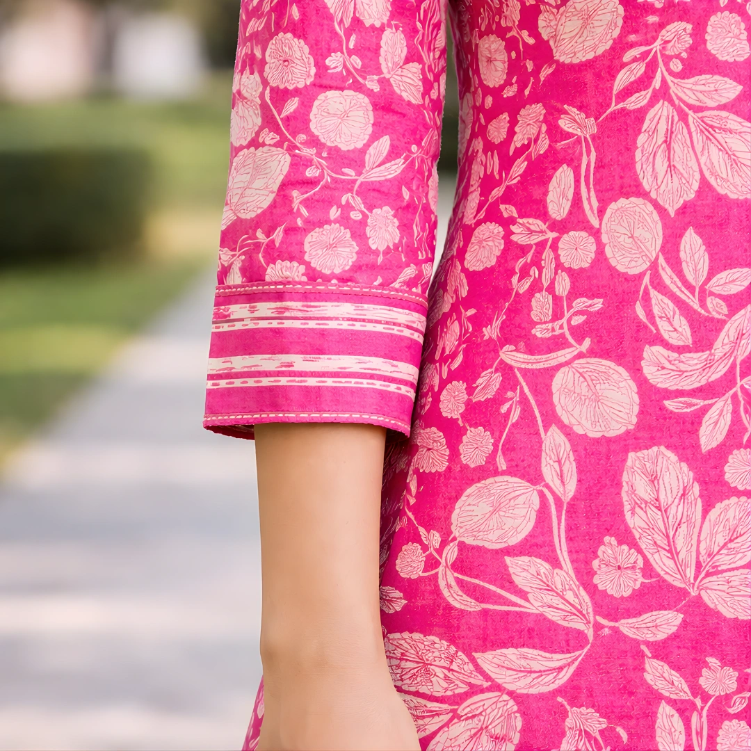 Side angle view of the pink printed salwar suit paired with a soft matching dupatta, showing the fluid fall and comfortable silhouette.
