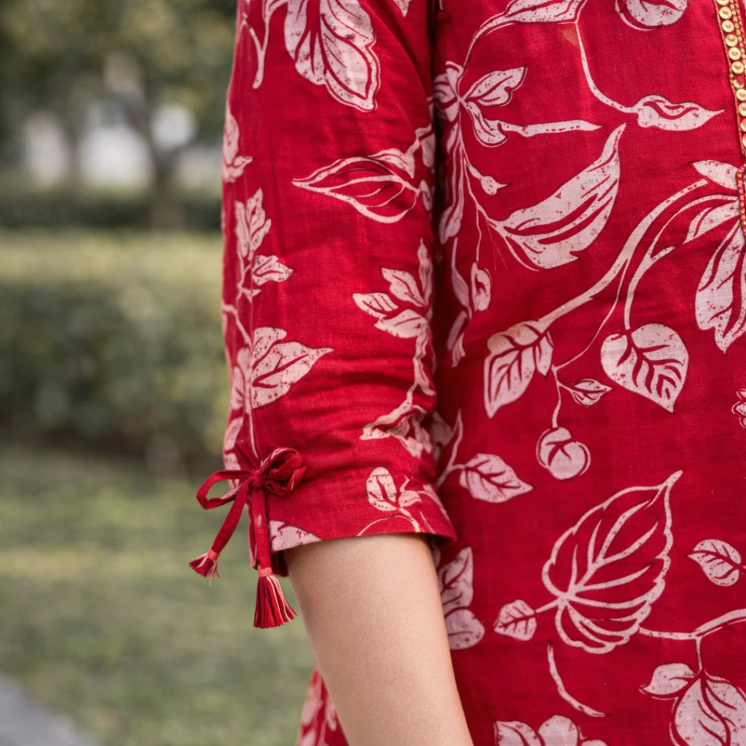 Red floral kurta sleeve design with tie detail