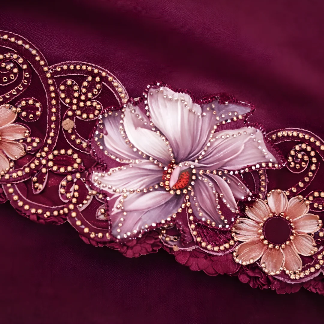 Wine saree pallu embroidery and floral blouse close up